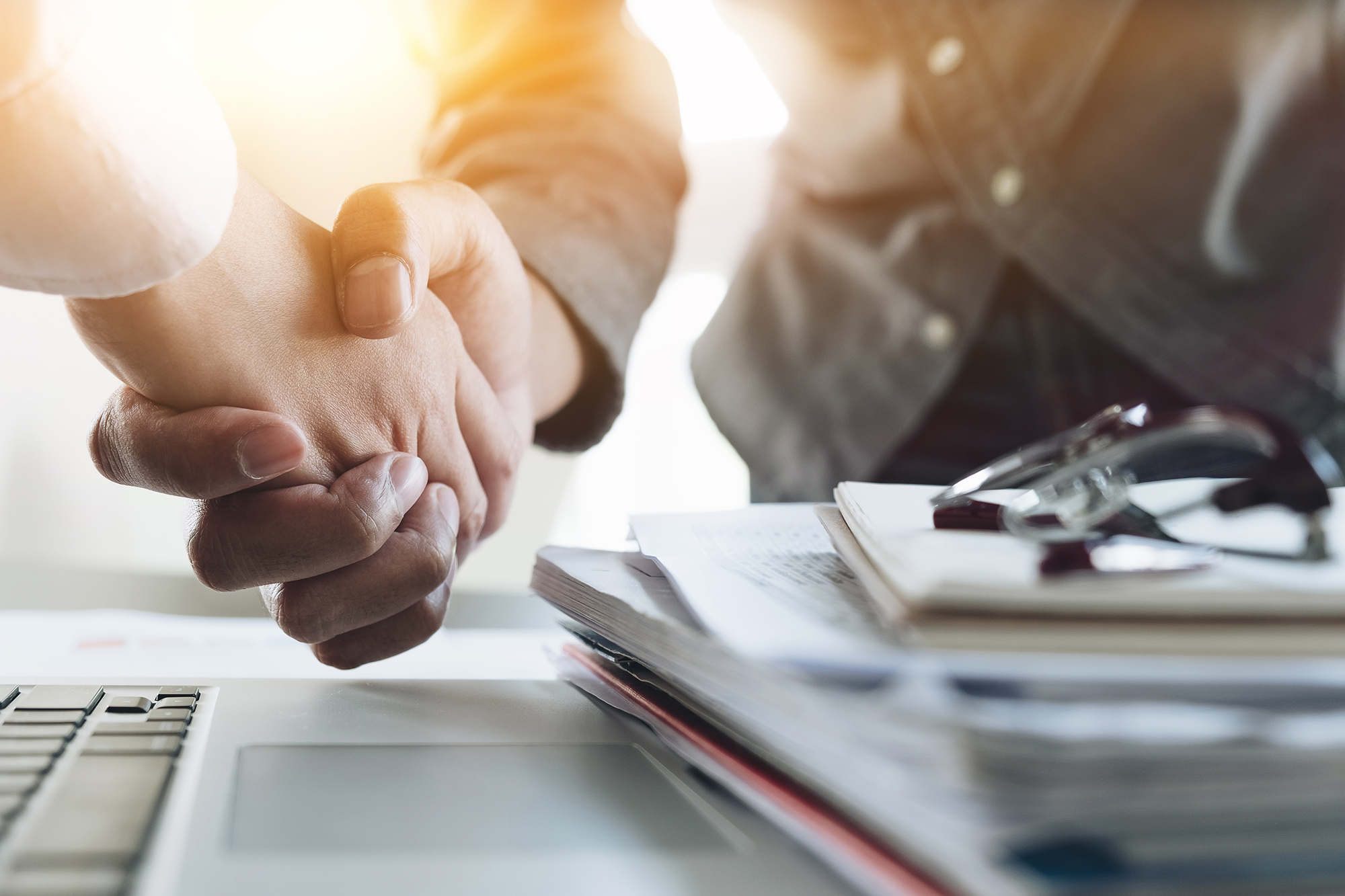 Close up of Business people shaking hands, finishing up meeting, business etiquette, congratulation, merger and acquisition concept Close up of Business people shaking hands, finishing up meeting, business etiquette, congratulation, merger and acquisition concept